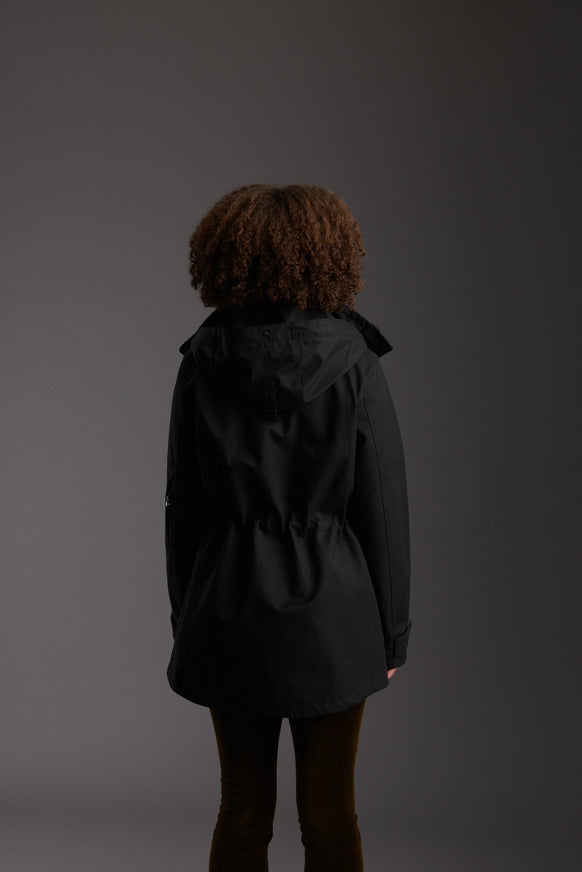 Back of Women's Carbon Black Waterproof Utility Field Jacket by Reeev
